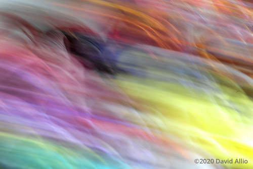 A rainbow of reflected light in an original visual abstraction by David Allio